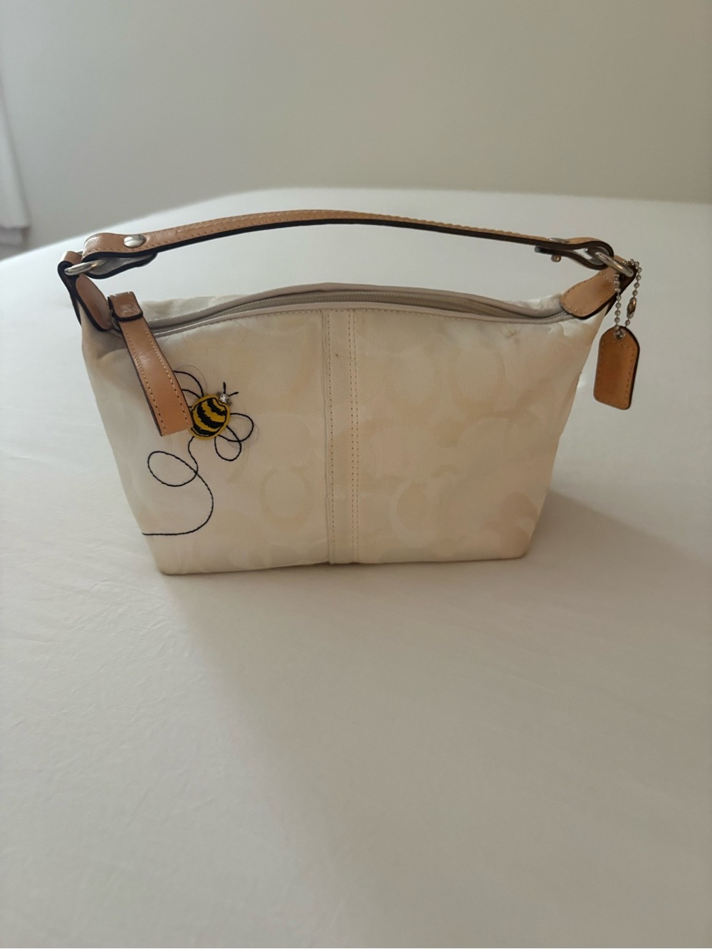 Coach Cream Signature Wristlet with Bee Accent and Tan Leather Trim